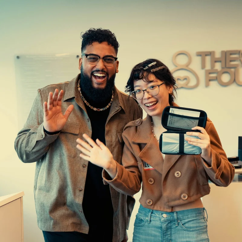 A man and a woman from NYF smiling